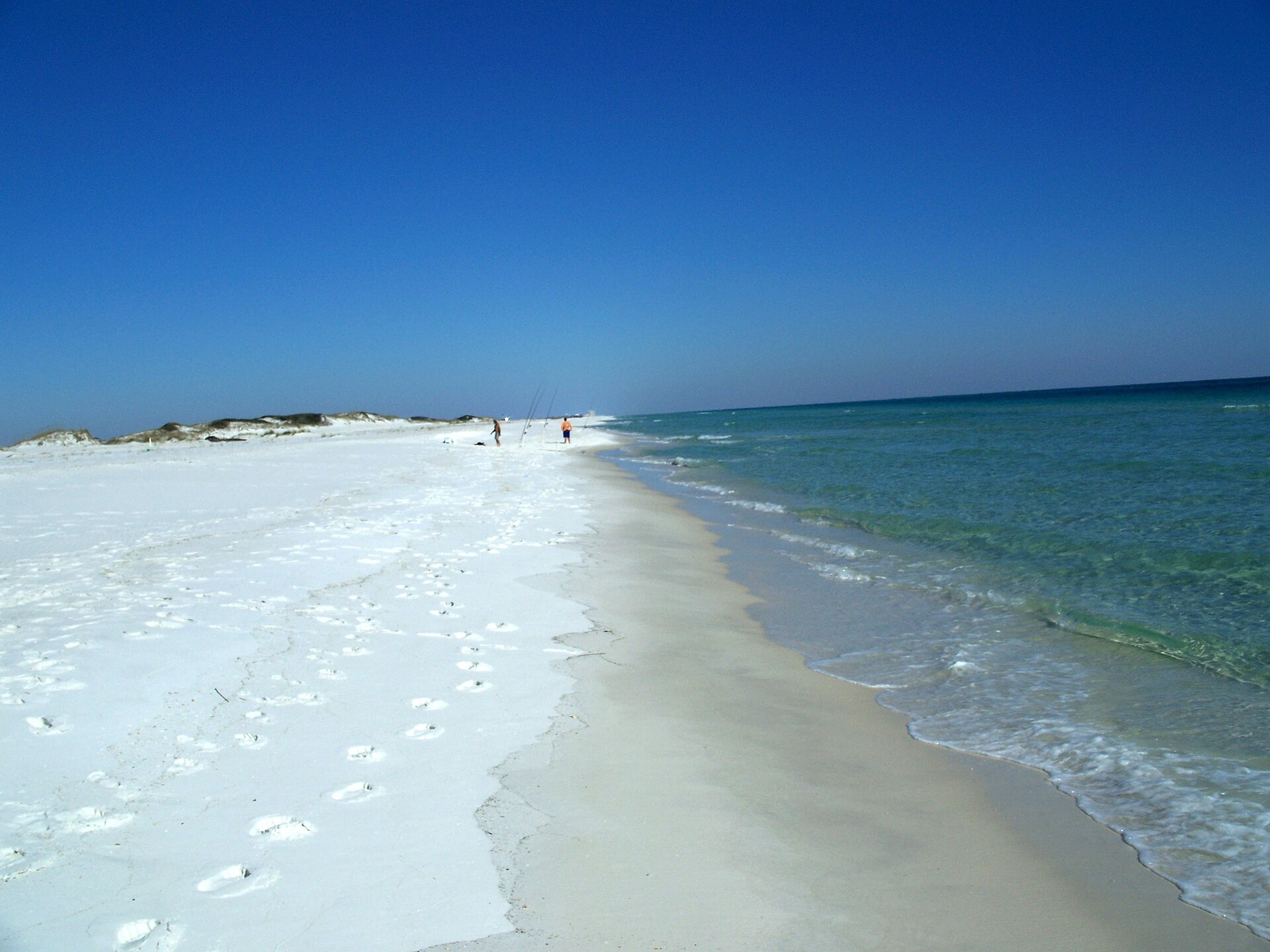Clear emerald Gulf water meeting sugar-white sand along the Santa Rosa shoreline in Northwest Florida